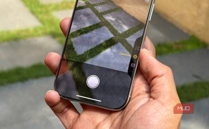 iPhone 16 Pro in a man's hand showing the Camera Control UI in Camera App