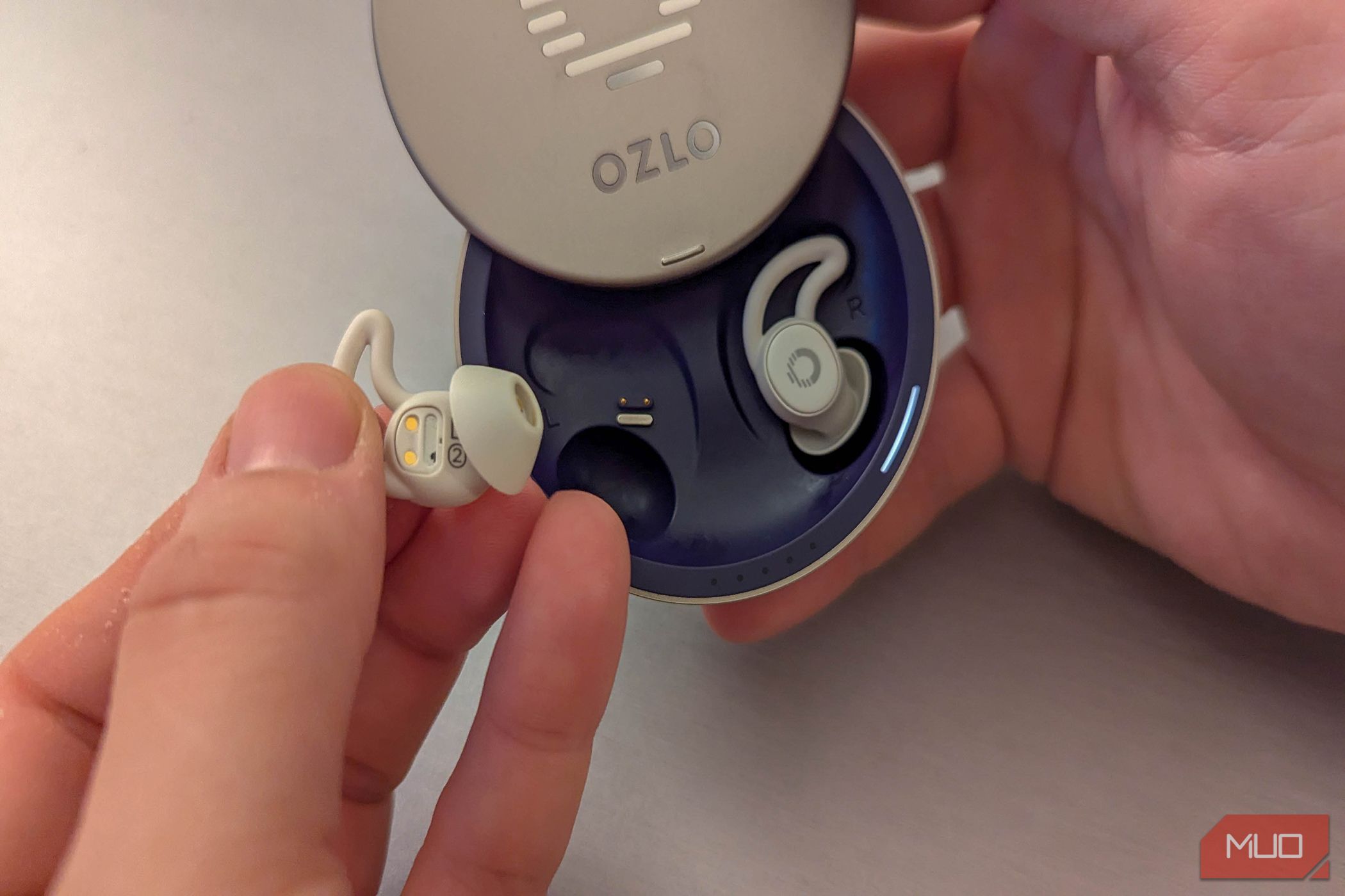 Ozlo Sleepbuds being pulled from their case