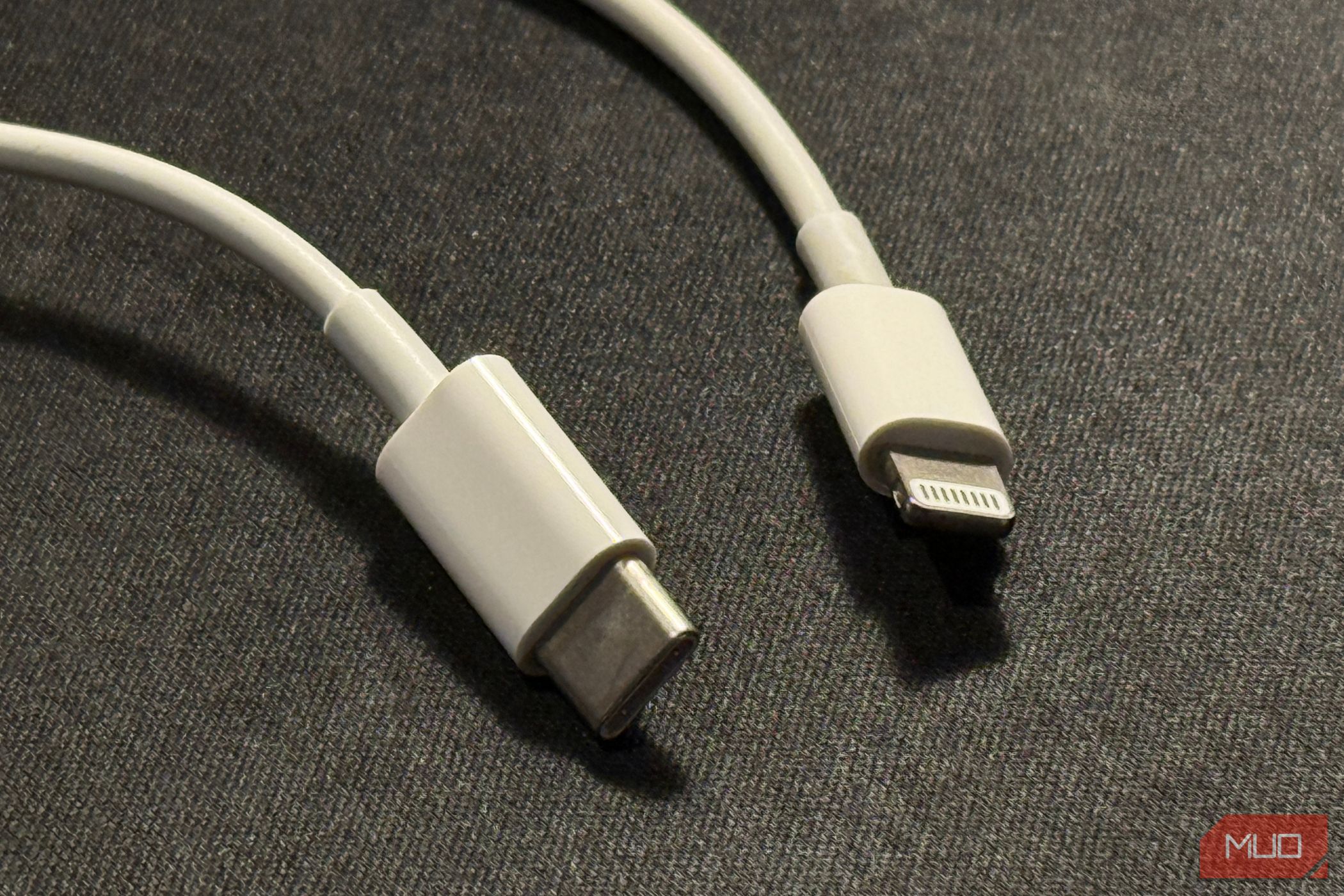 the two ends of a usb c to lightning charging cable