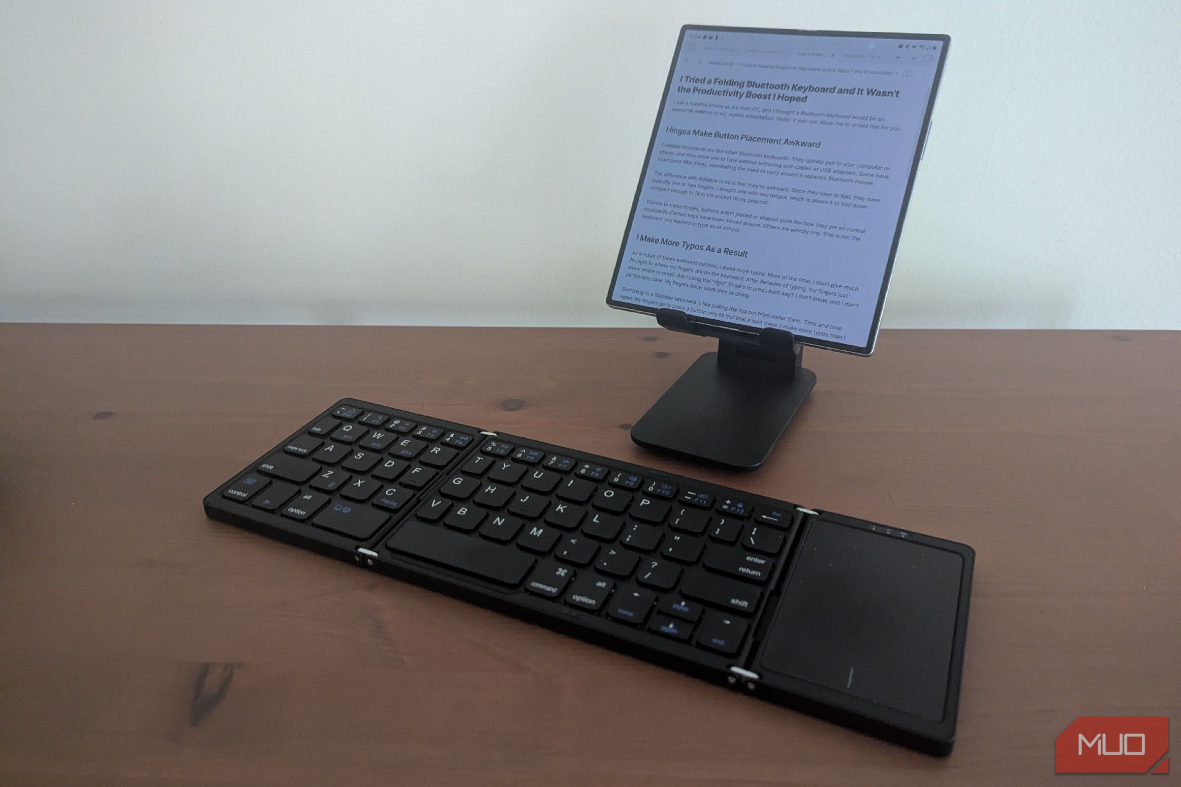 A foldable Bluetooth keyboard paired with a foldable phone.