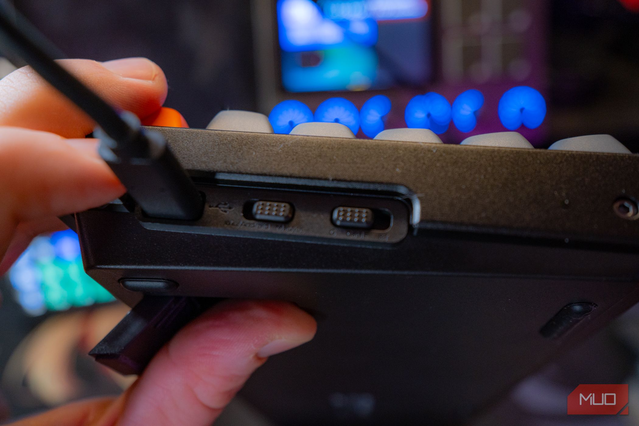 Keychron K8 Max side view showing extended feet and controls.