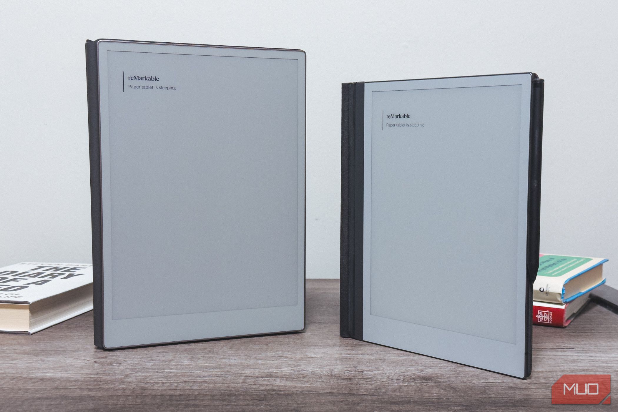 reMarkable Paper Pro next to reMarkable 2 on wooden table.