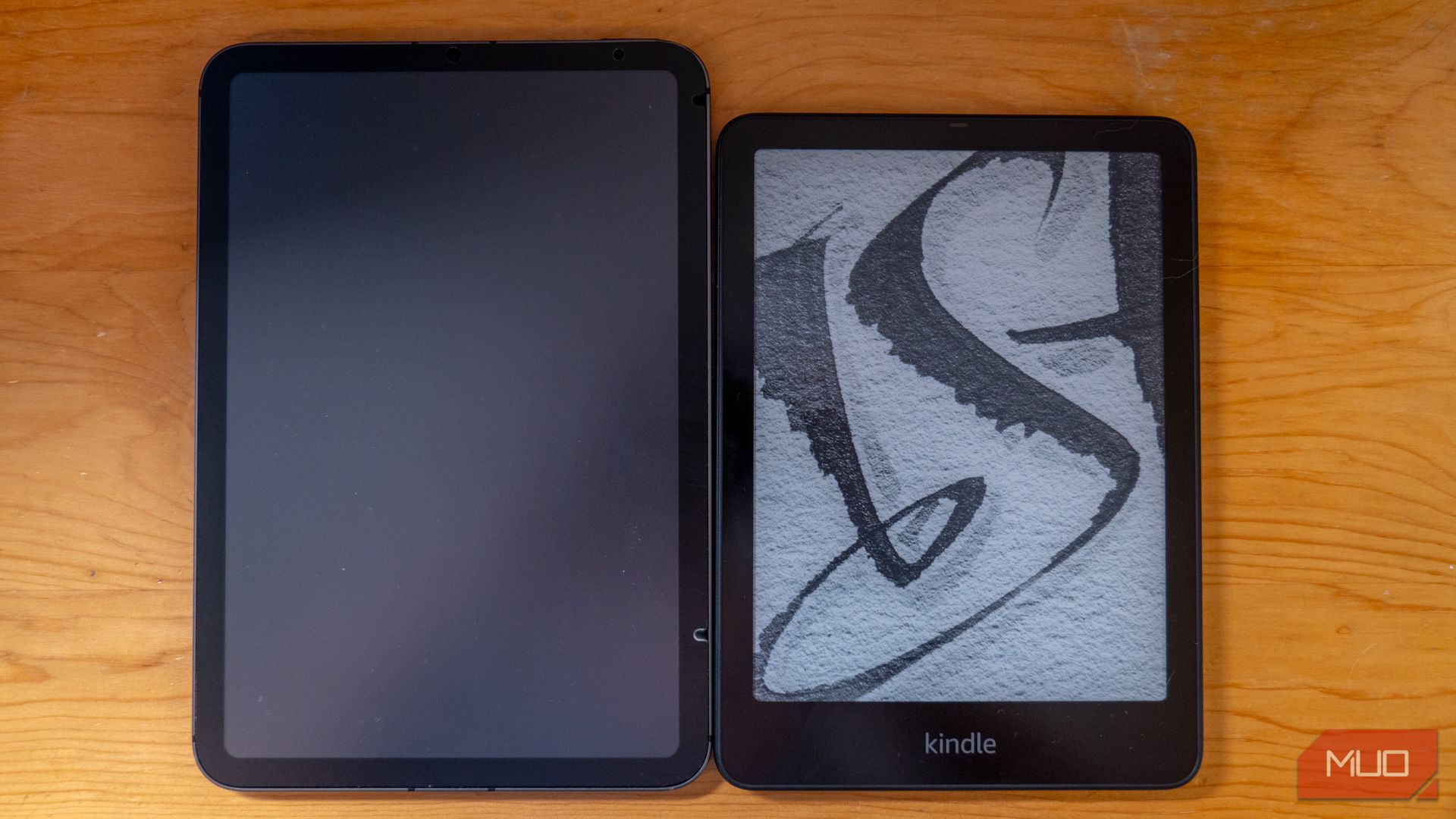 Amazon Kindle Paperwhite Signature Edition next to an iPad mini.