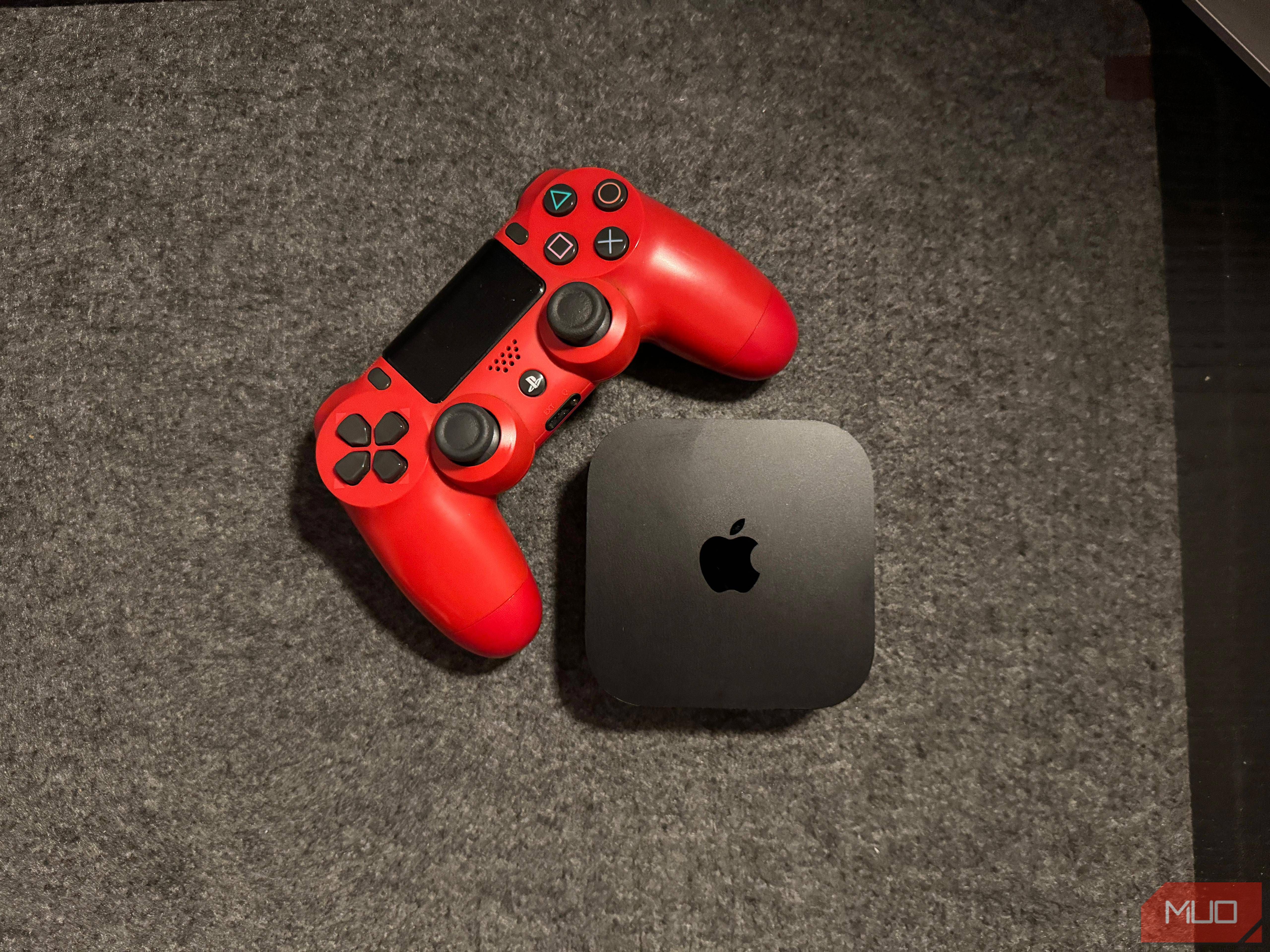 Apple TV next to a PS4 controller