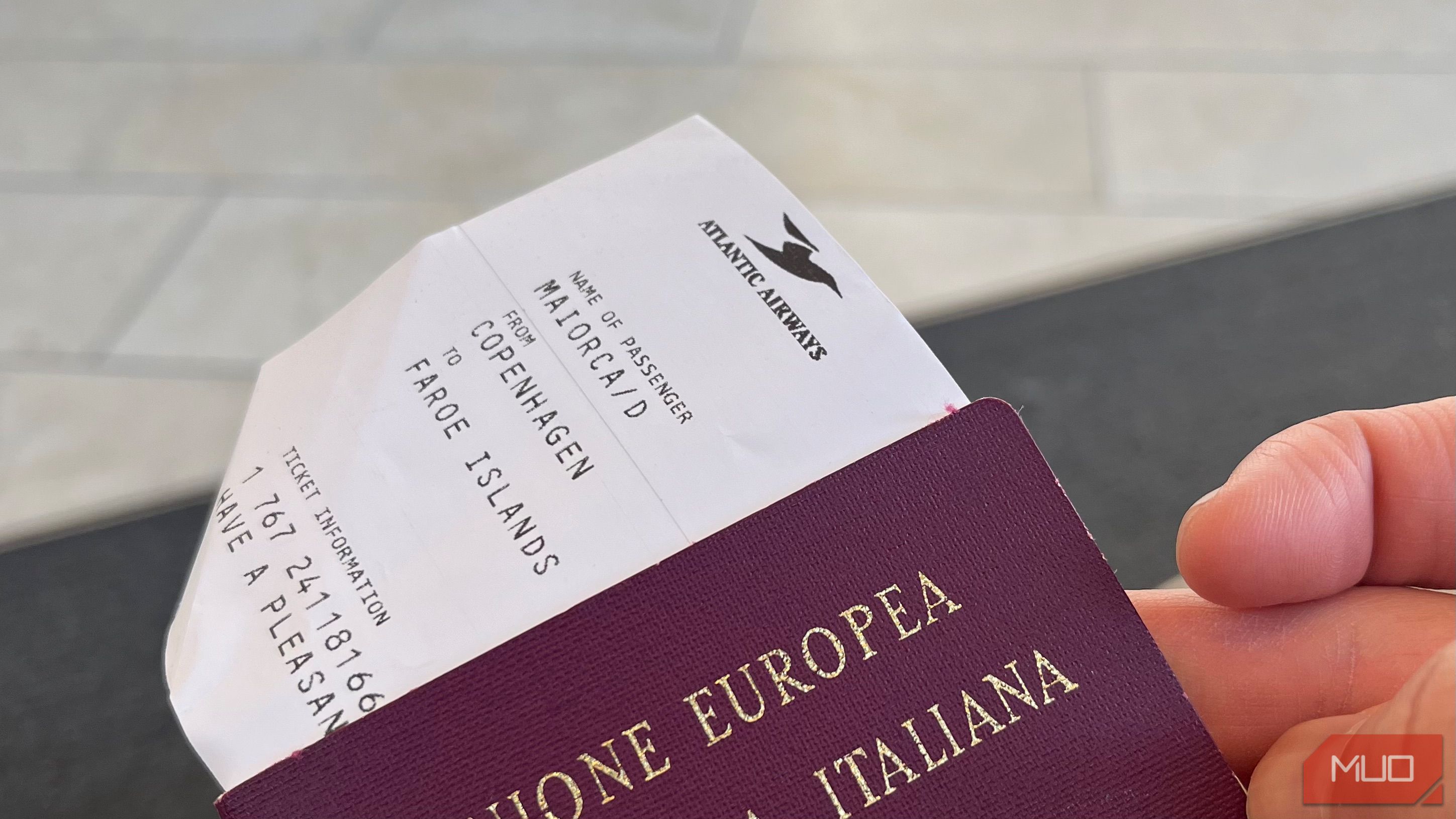 An image of a boarding pass tucked inside a passport