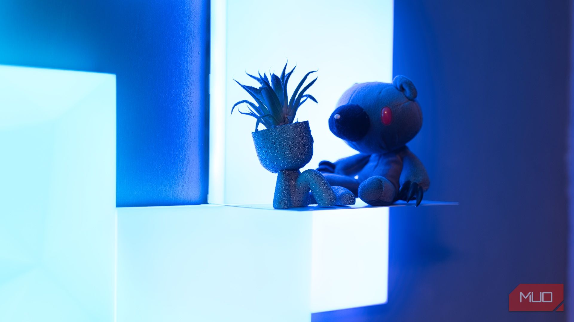 Nanoleaf Blocks review - gloomy bear and a 3d printed plant pot sitting on the Blocks shelf