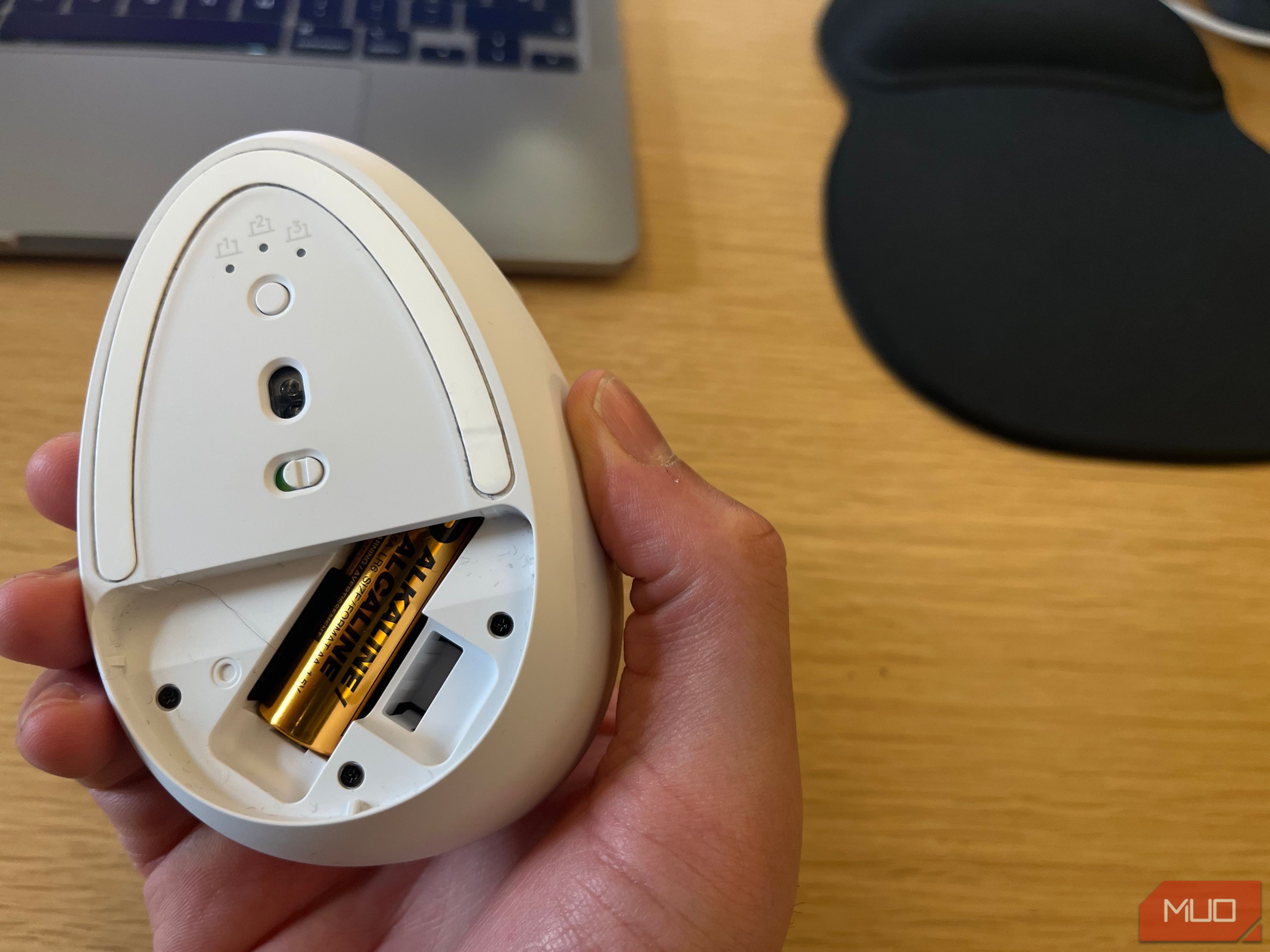 A replaceable battery inside a wireless mouse