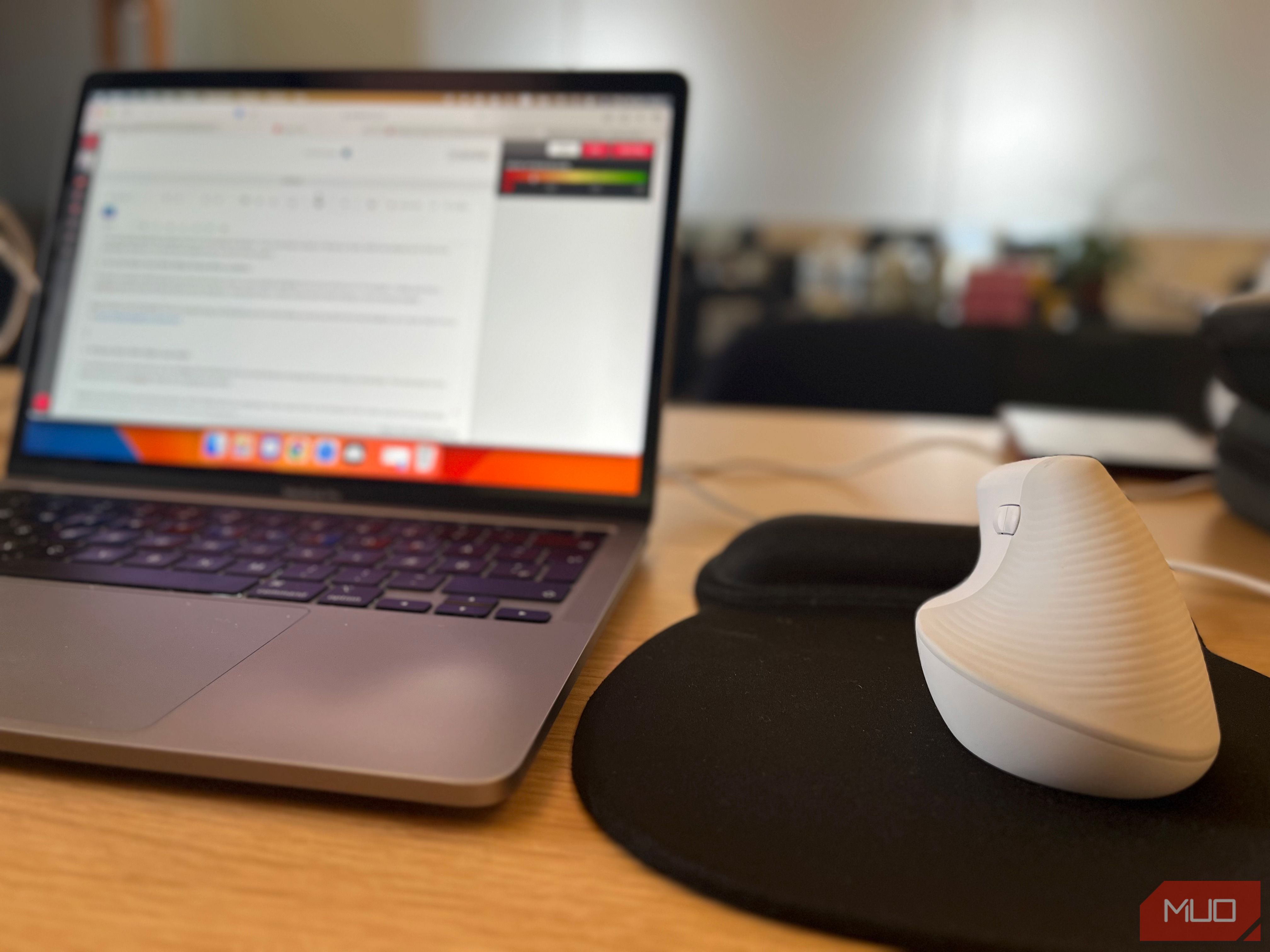 An image of a wireless mouse in a coworking space setup 