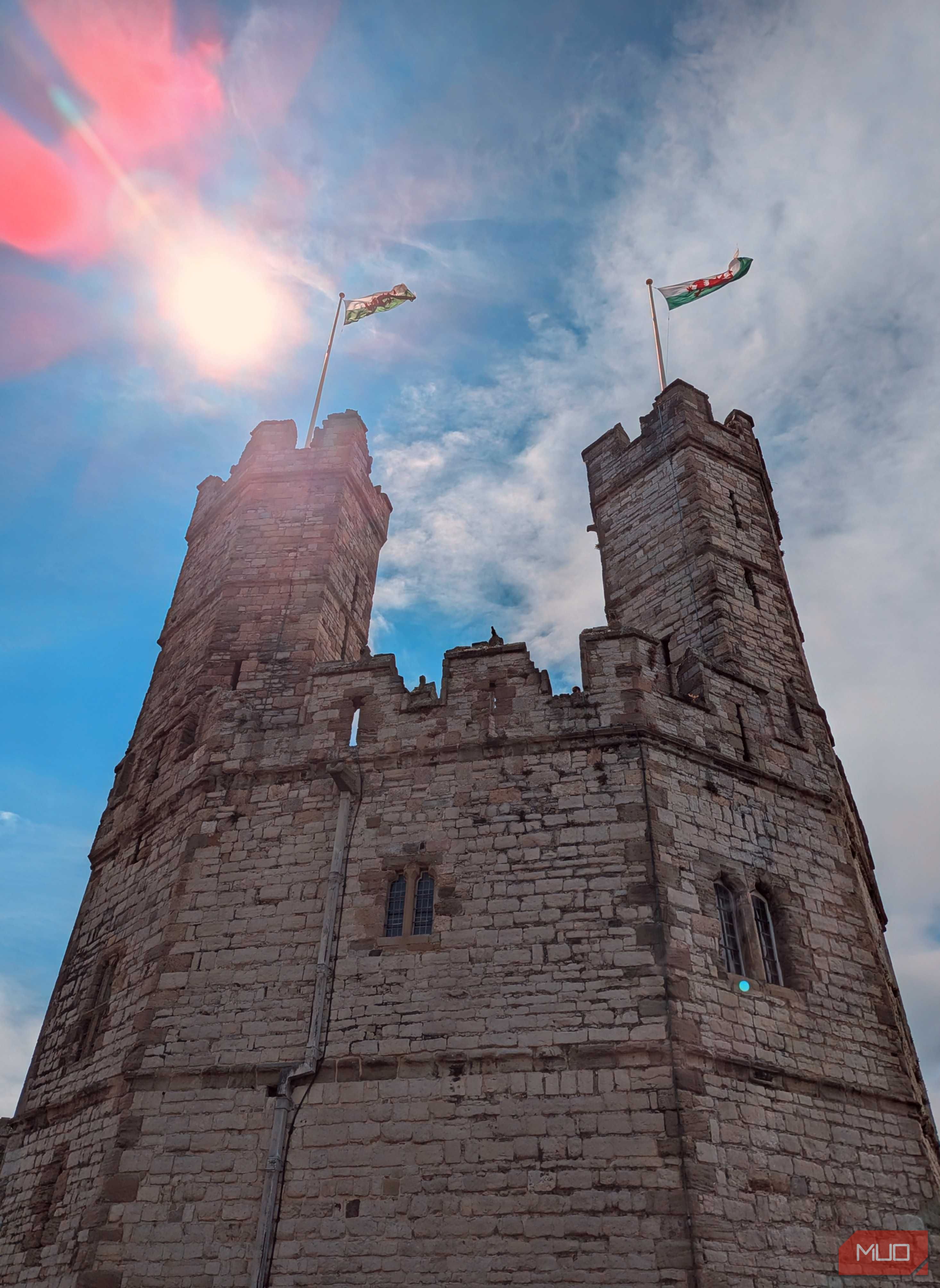 A low-angle shot of a Welsh castle
