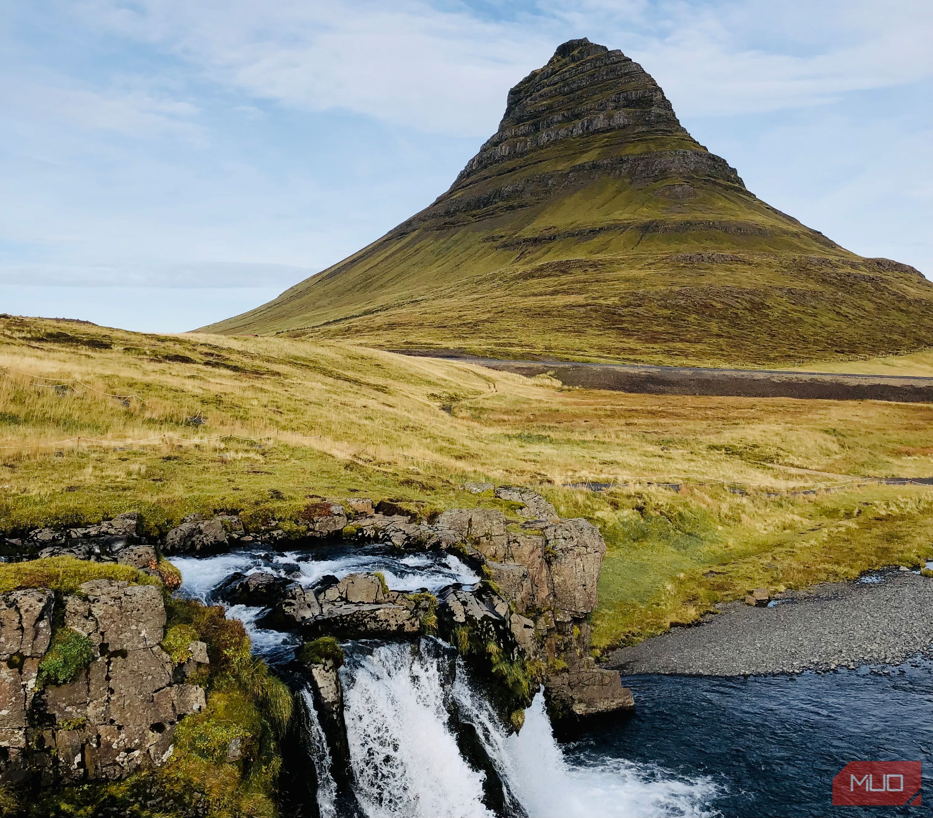 An Image of a Mountain and a Waterfall