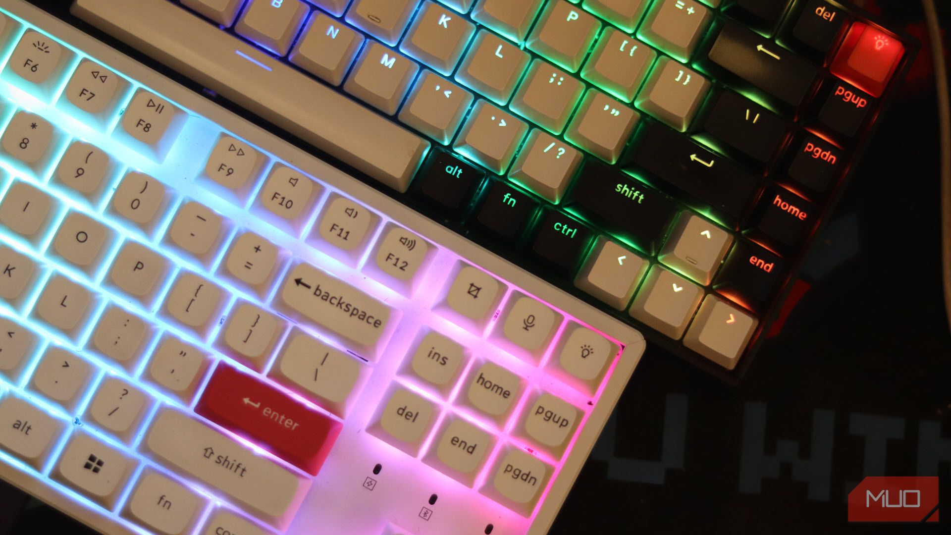 Two mechanical keyboards on a desk