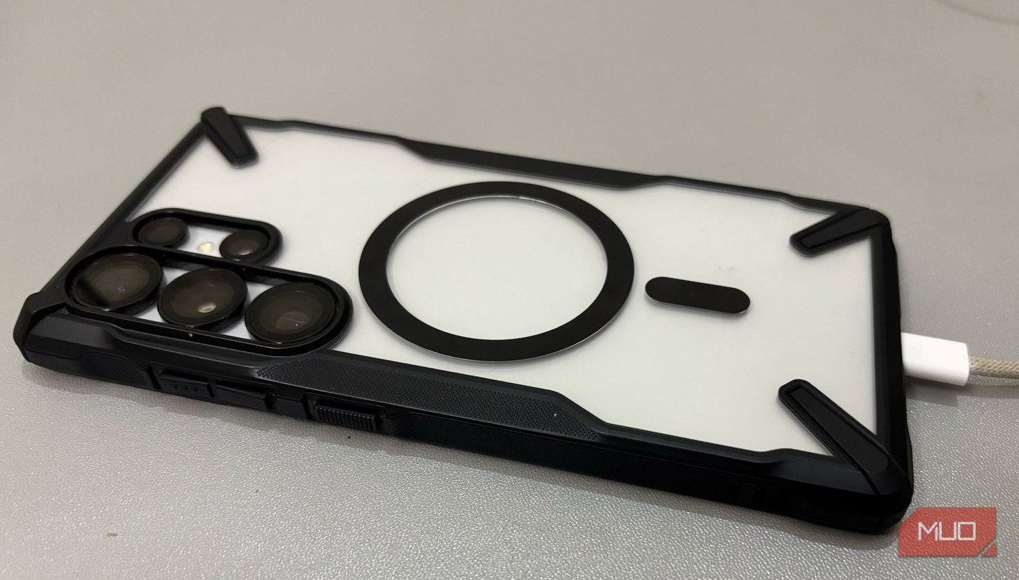 A charging cable is attached to the S25 ultra