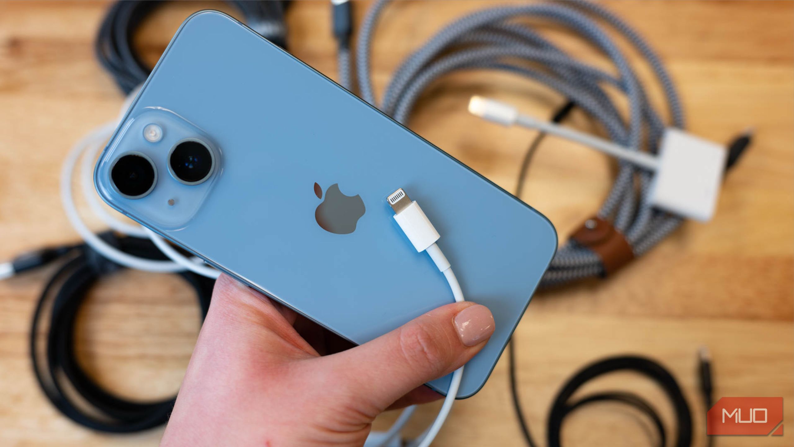 Iphone 13 with an electric cable on top
