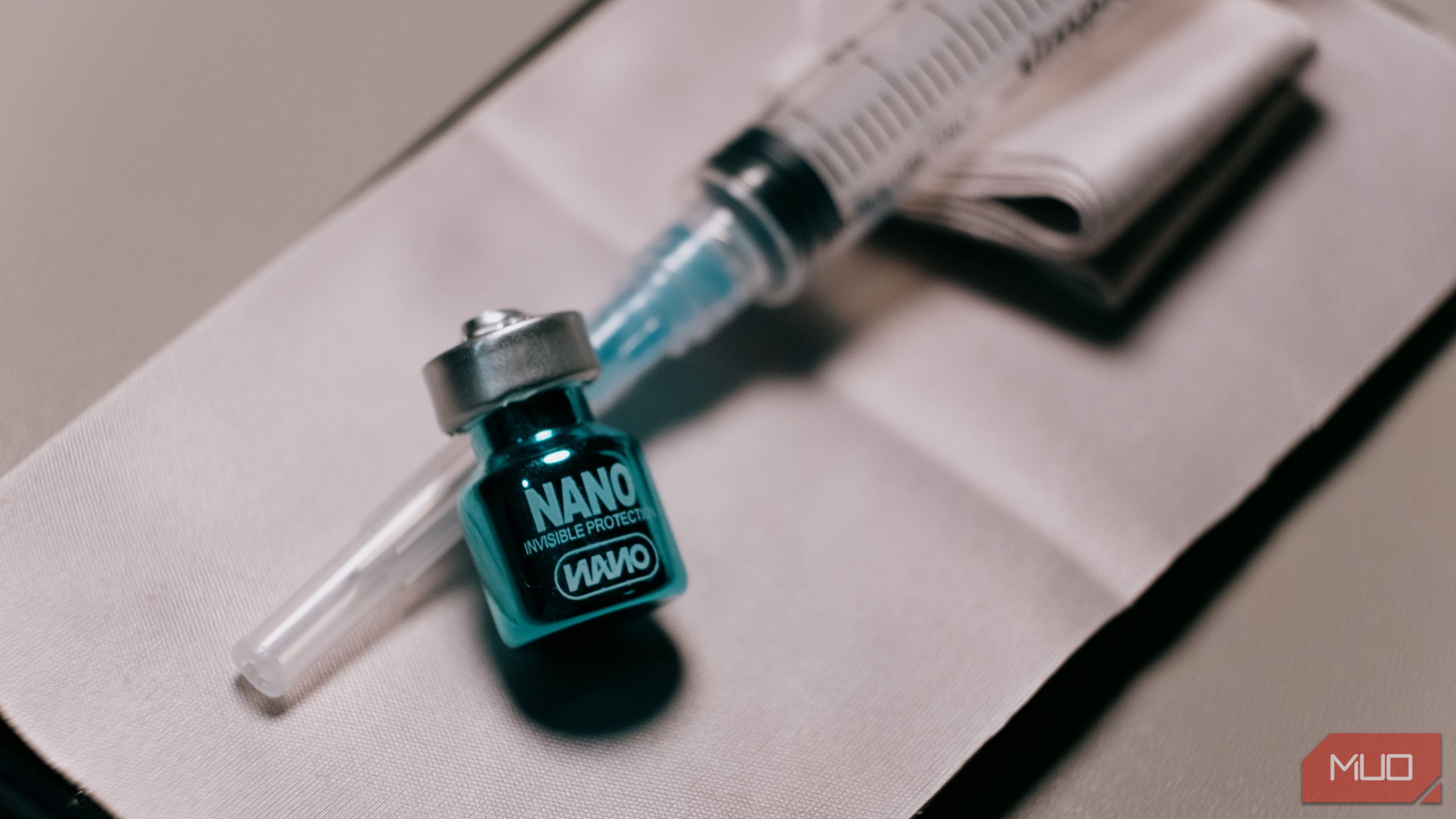 Nano oleophobic coating beside a syringe