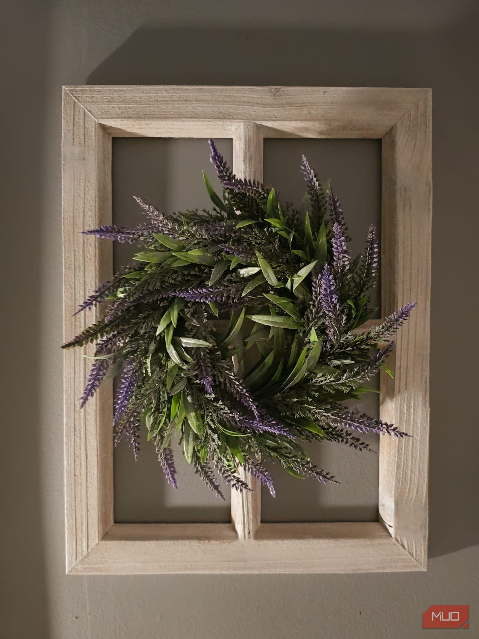 A wooden frame and wreath decoration in low lighting—HDR enabled