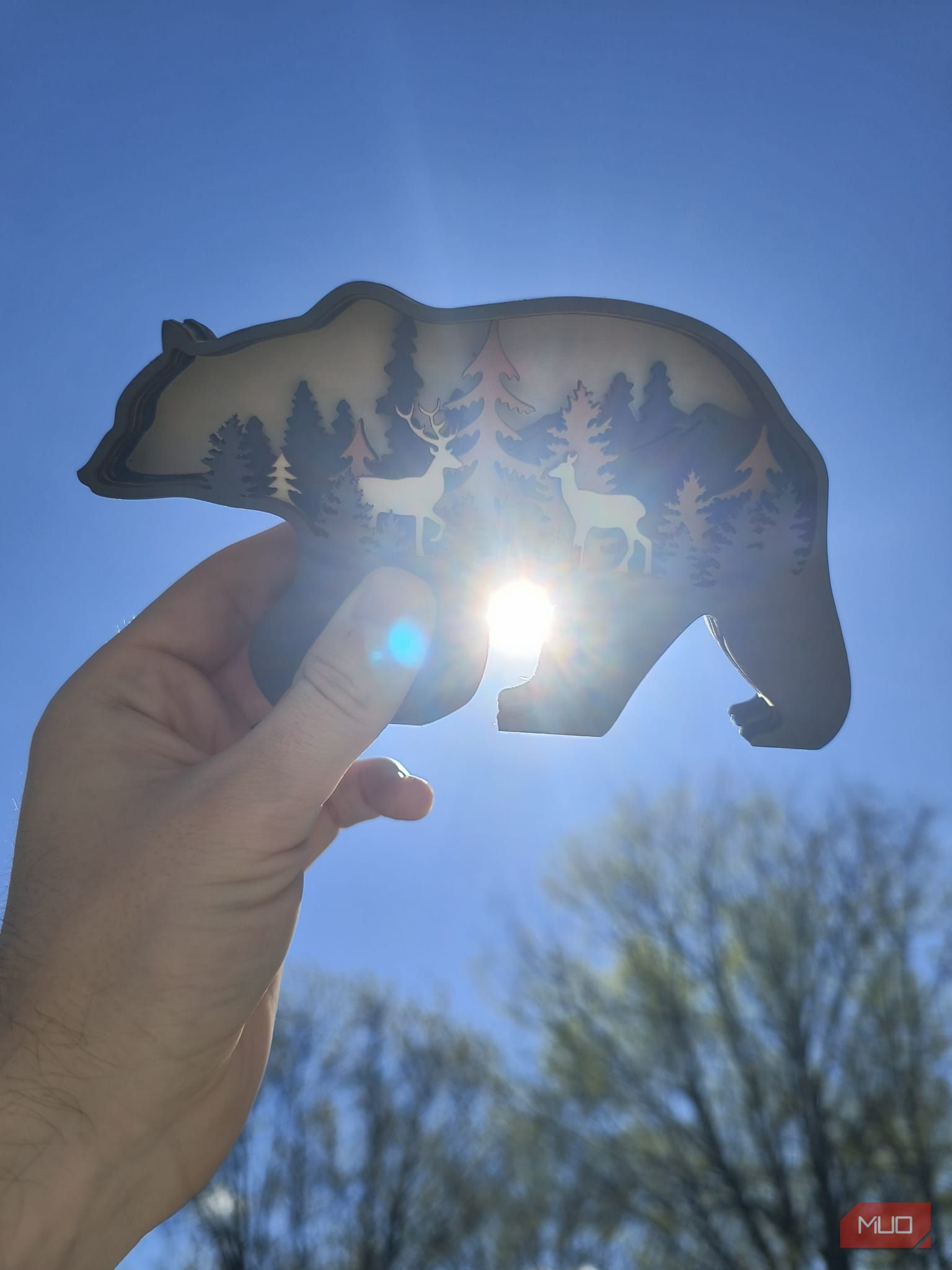 A bear decoration with the sun poking through its legs—HDR enabled