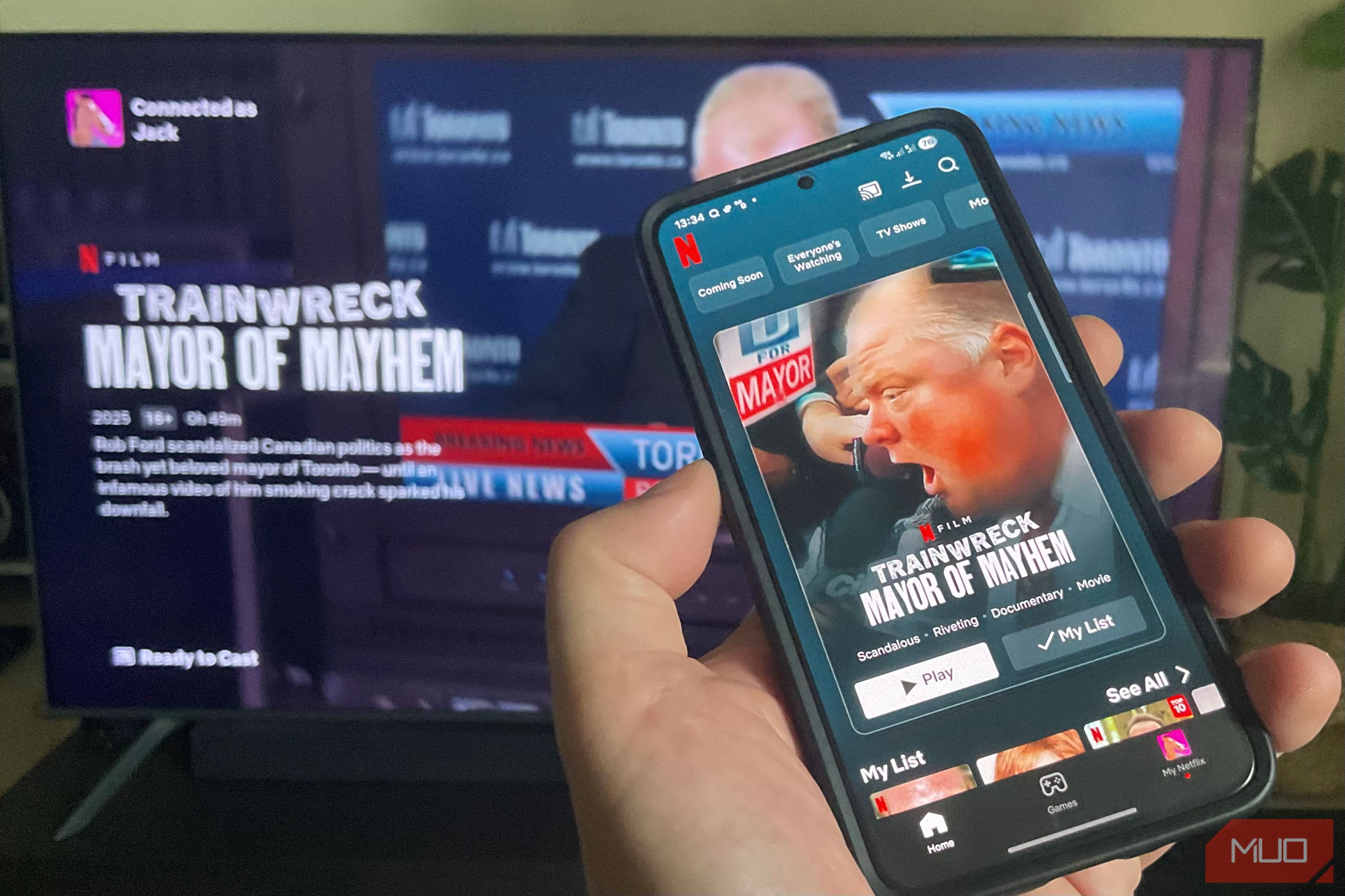 A mobile phone casting to a Chromecast.