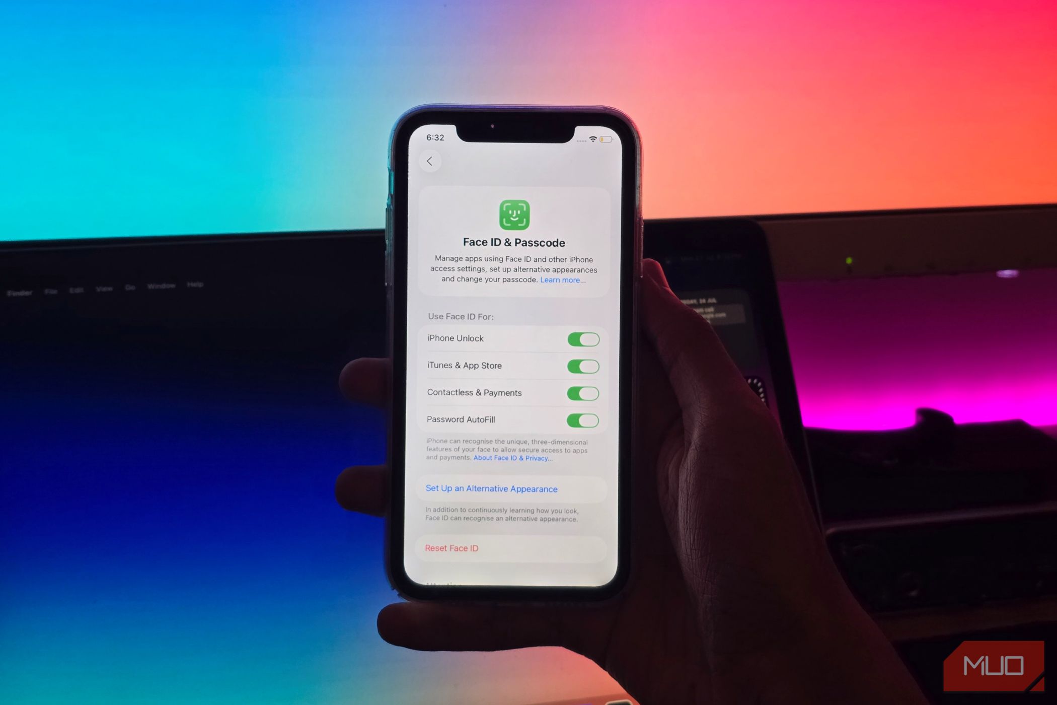 A person holding an iPhone with the Face ID & Passcode menu open