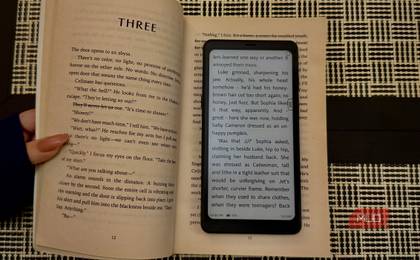 Boox Palma 2 on top of a book