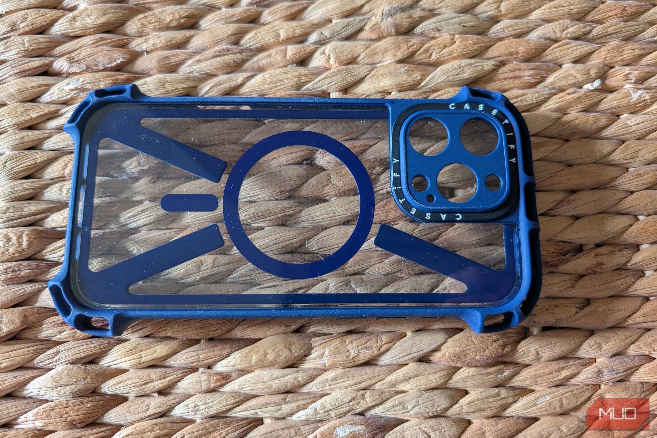 A clear iPhone case on a rugged surface