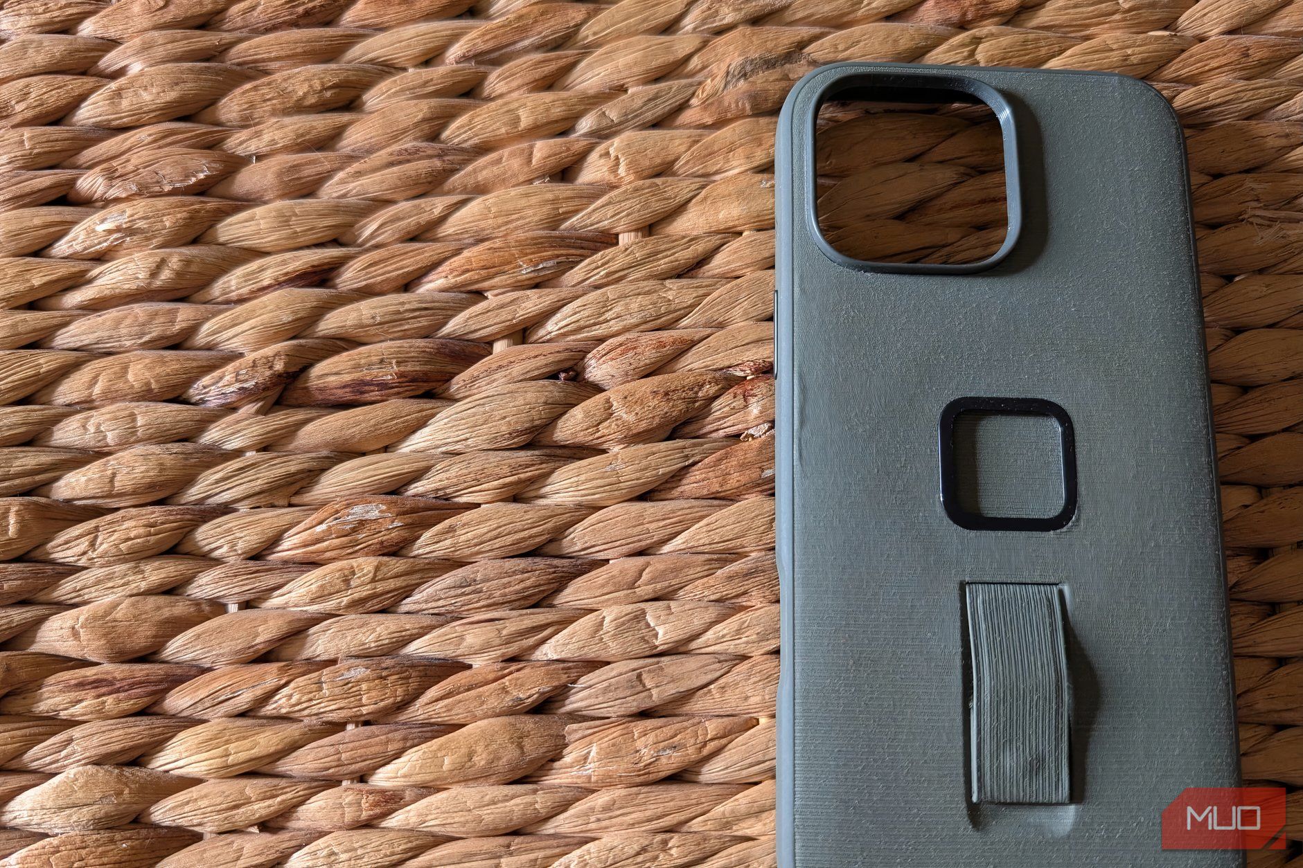 A specialty iPhone case on a rugged surface
