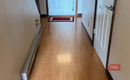 A clean hallway floor in a home. 