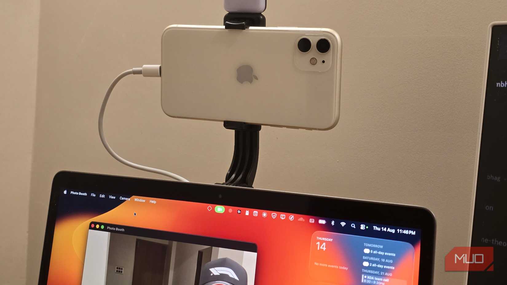 iPhone being used as a webcam mounted on top of a MacBook