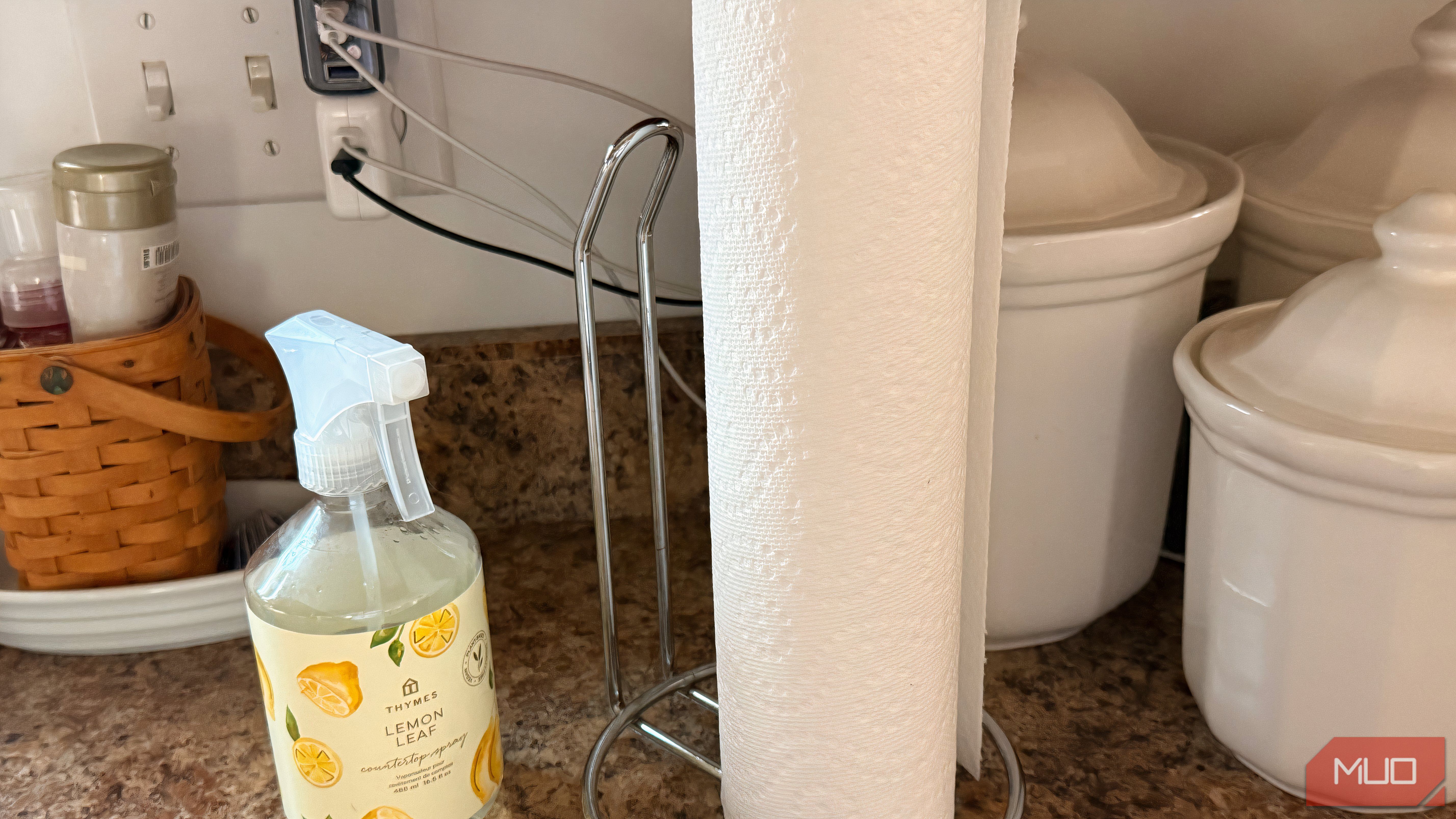 A kitchen table showing a roll of paper and other items.