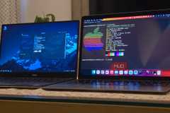 MacBook and a Dell laptop running ZorinOS next to each other