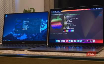MacBook and a Dell laptop running ZorinOS next to each other
