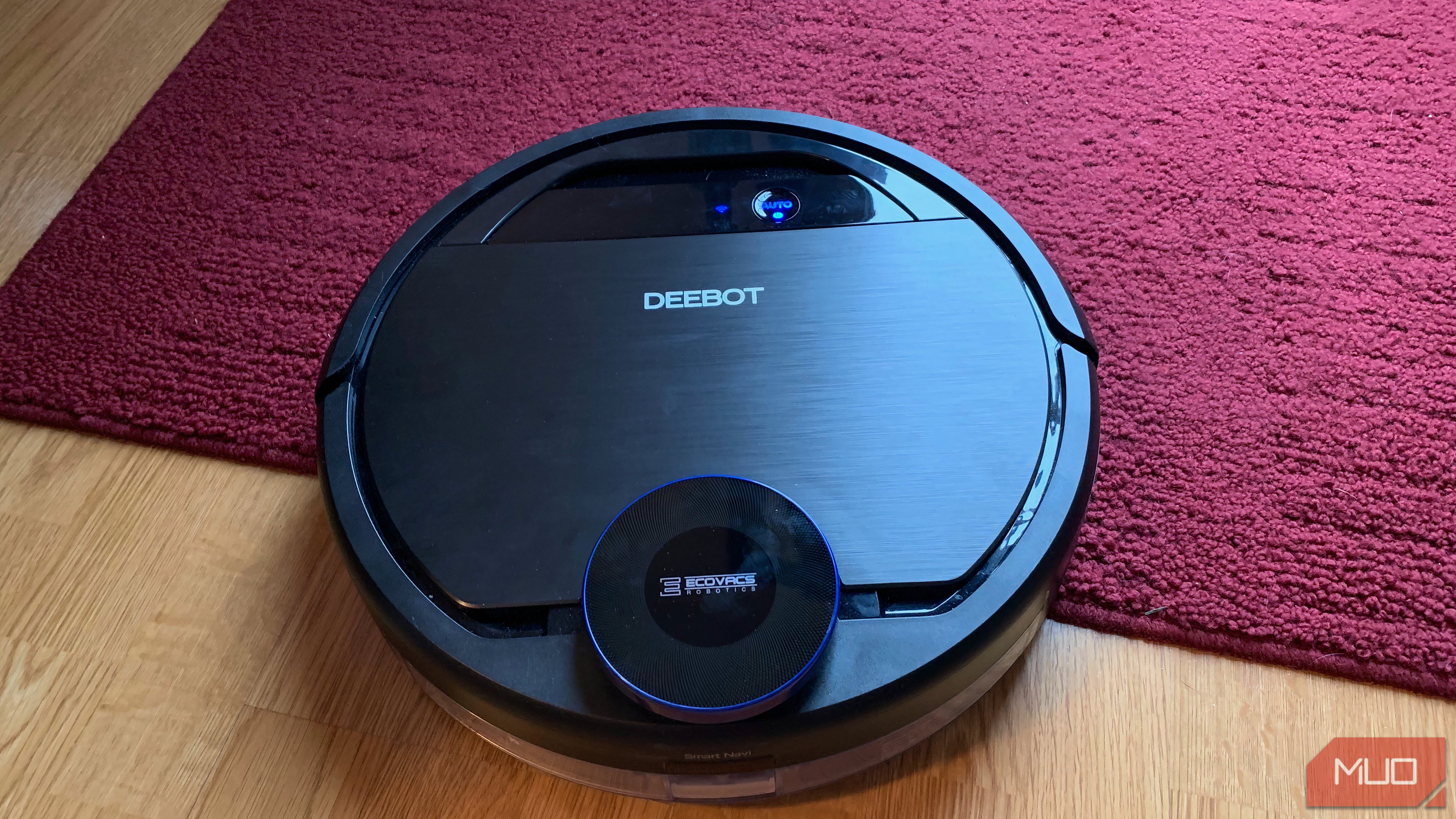 A robot vacuum near carpet.