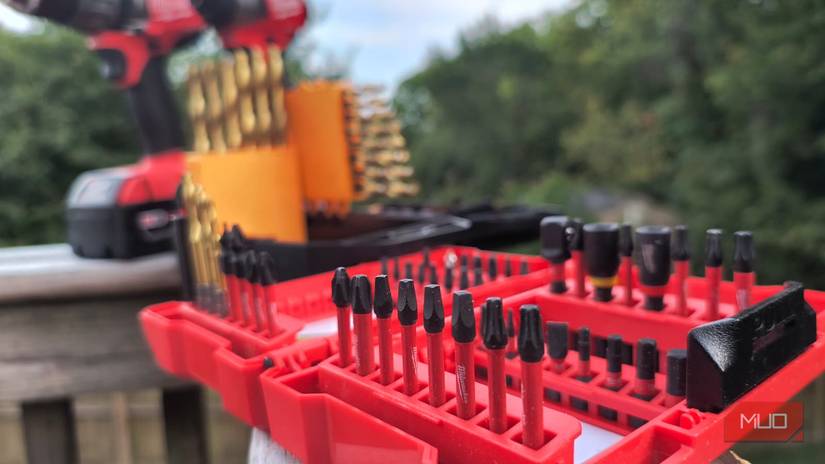Drill and driver bits on a wooden rail