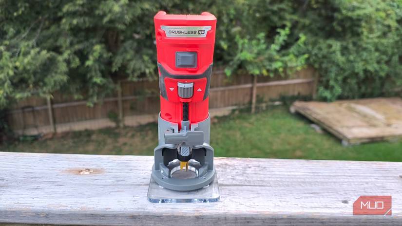 A cordless router on a wooden rail