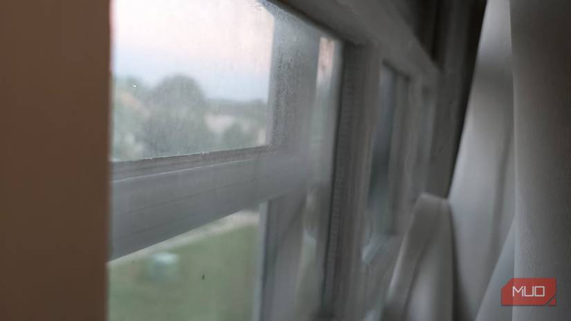 A window with too much cleaning solution on it, causing a haze