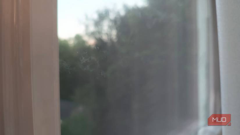 A window cleaned with a paper towel, causing streaks and smudges